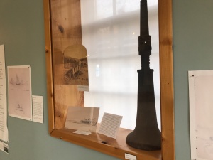 An early 19th century porgy (menhaden) press on display at the Northeast Harbor Maritime Museum on Mt. Desert Island. After cooking the fish, factory workers used heavy duty screw jacks like this to press the oil out of the fish. Photo by David Cecelski