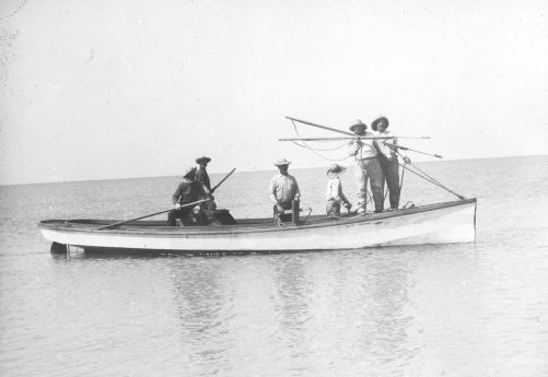 Roosevelt and Coles posing with their harpoons. Behind them (left to right) are Roland Phillips, Mart Lewis, Capt. Charlie Willis &amp; Capt. Jack McCann. Photo courtesy, Walter Coles, Sr., Chatham, Va.
