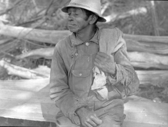 Fisherman at the Brickle fishery near Edenton, N.C., ca. 1937-39. When Farrell visited the site, he saw a sign of changing times: the fishermen were hauling in their seine with a line attached to an automobile's axle. Photo by Charles A. Farrell. Courtesy, State Archives of North Carolina